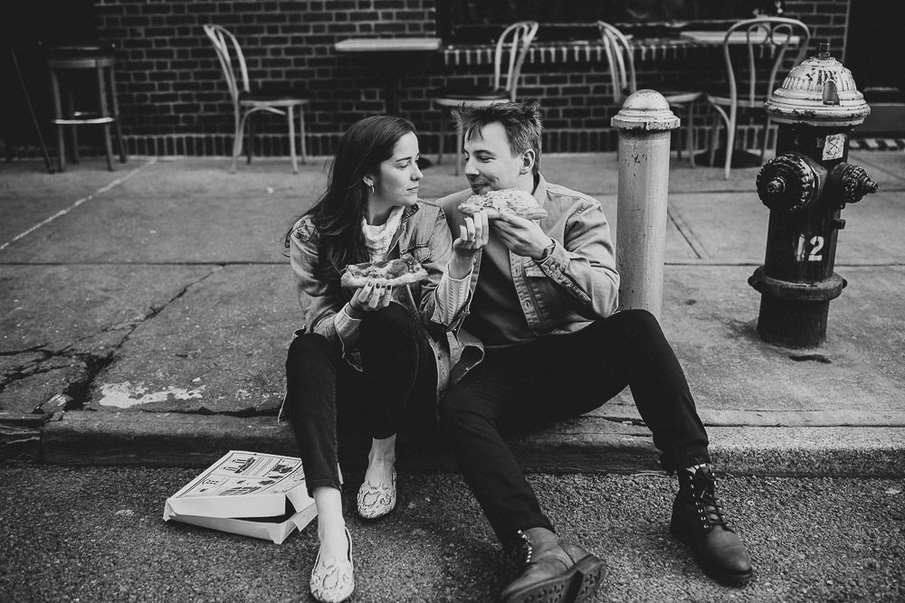 Couple eats pizza during engagement shoot in the west village of nyc