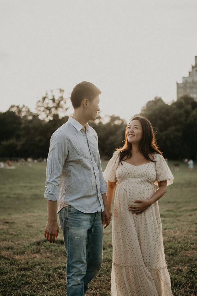 Expecting couple in prospect park at golden hour during maternity session