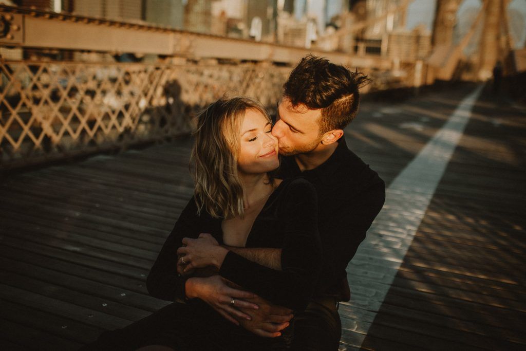 Couple on brooklyn bridge at sunrise during elopement photoshoot