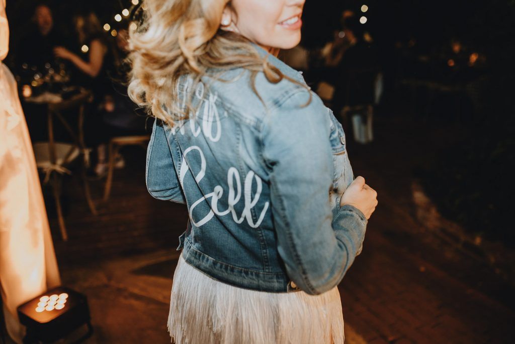Bride with denim jacket at los angeles wedding