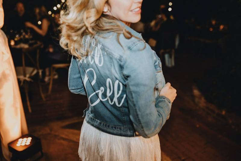 Bride with denim jacket at los angeles wedding