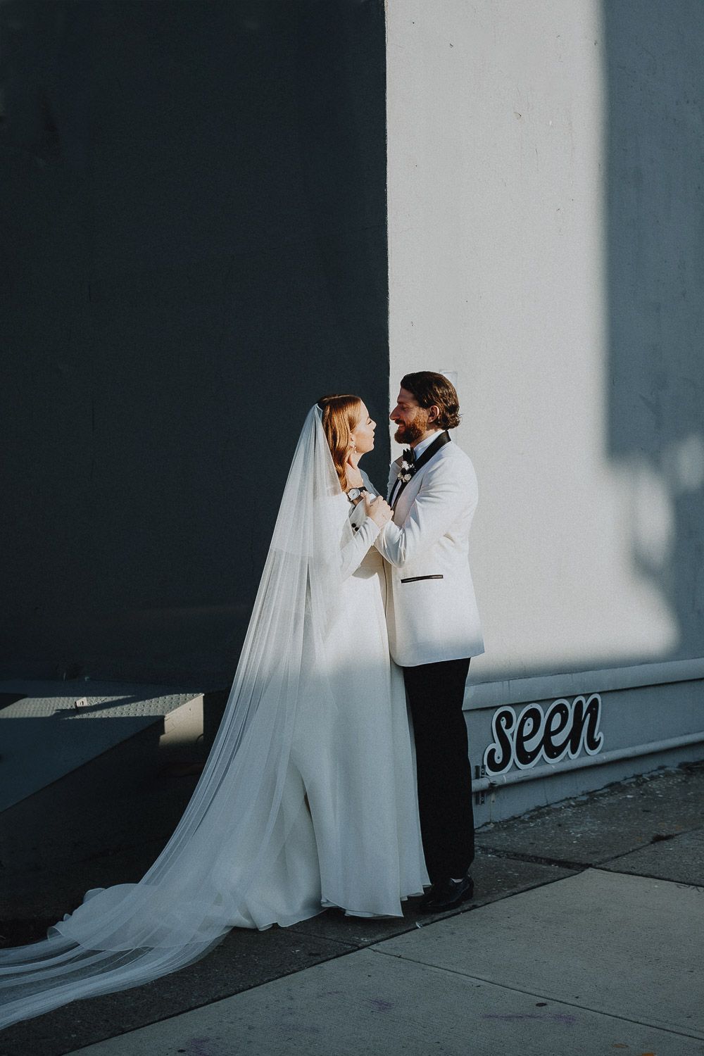 Artsy creative wedding photo in harsh light and shadows
