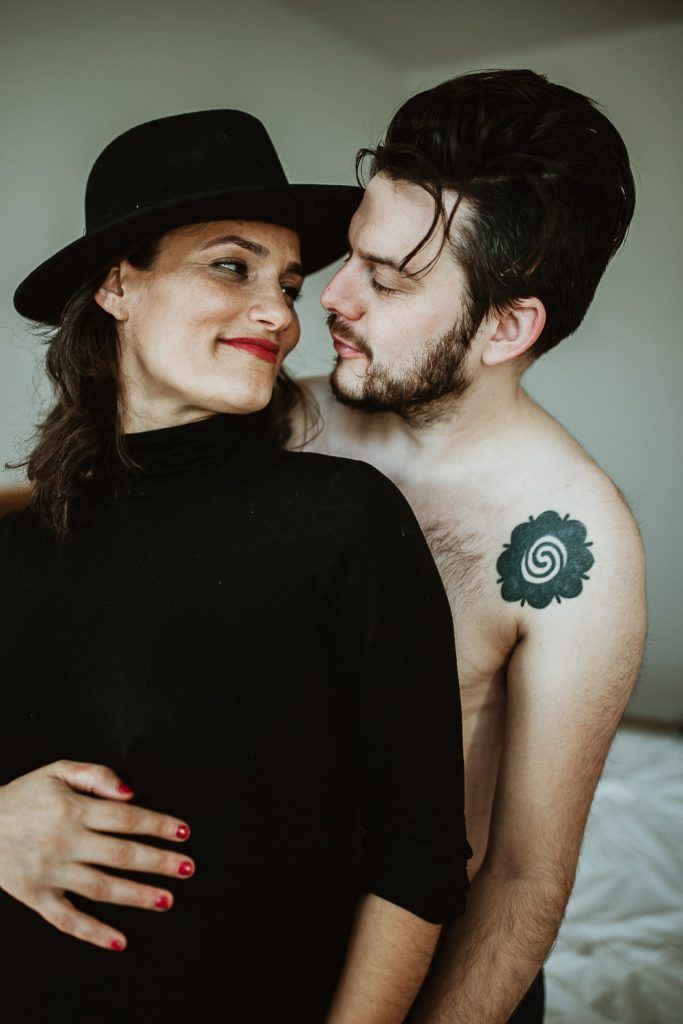Expecting couple during maternity photoshoot at home in brooklyn