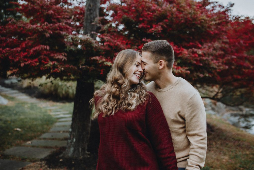 Couple during fall engagement photoshoot in west point