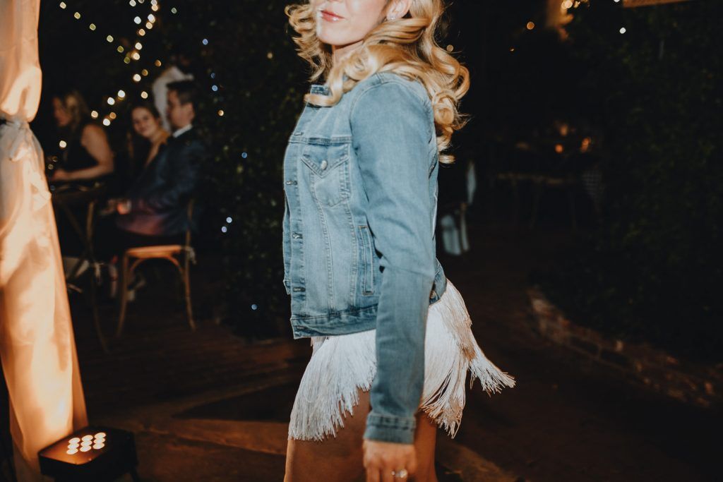 Bride with denim jacket at los angeles wedding