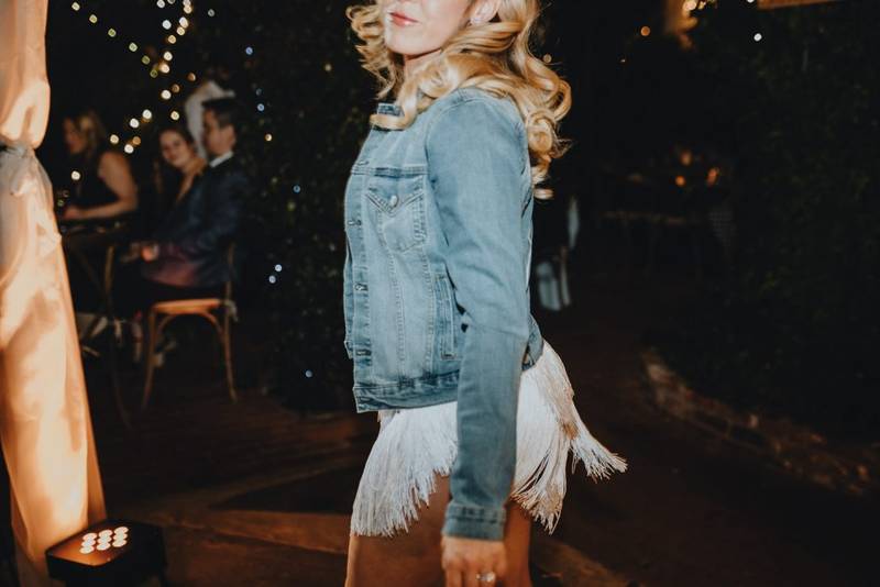 Bride with denim jacket at los angeles wedding