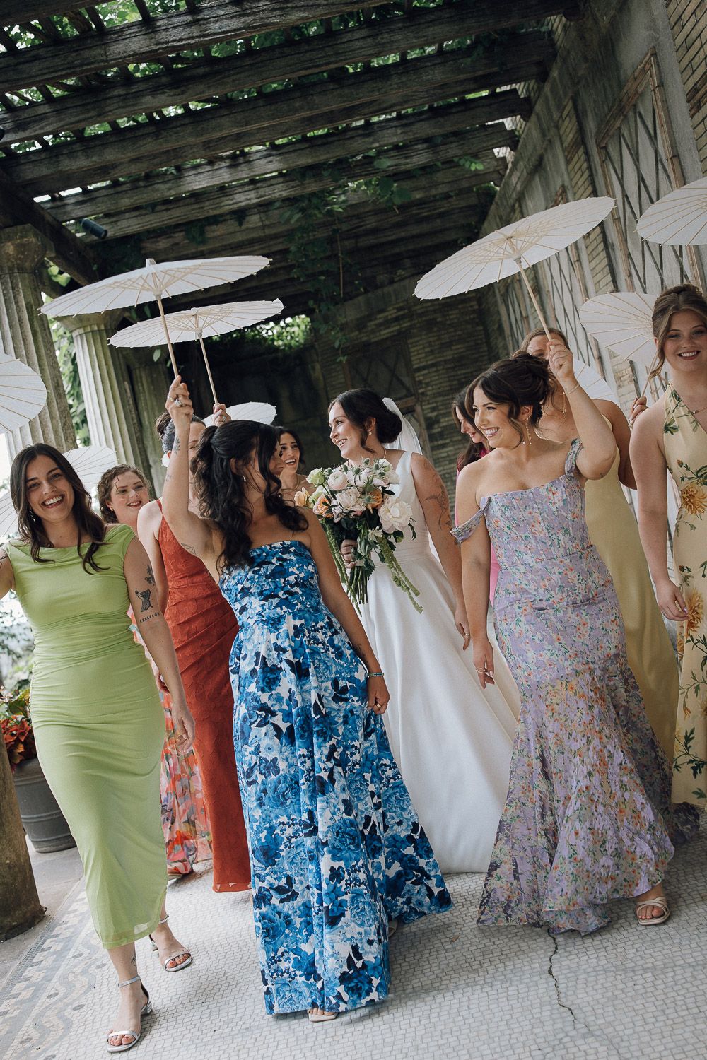 Colorful mismatched bridesmaids at italy tuscany wedding