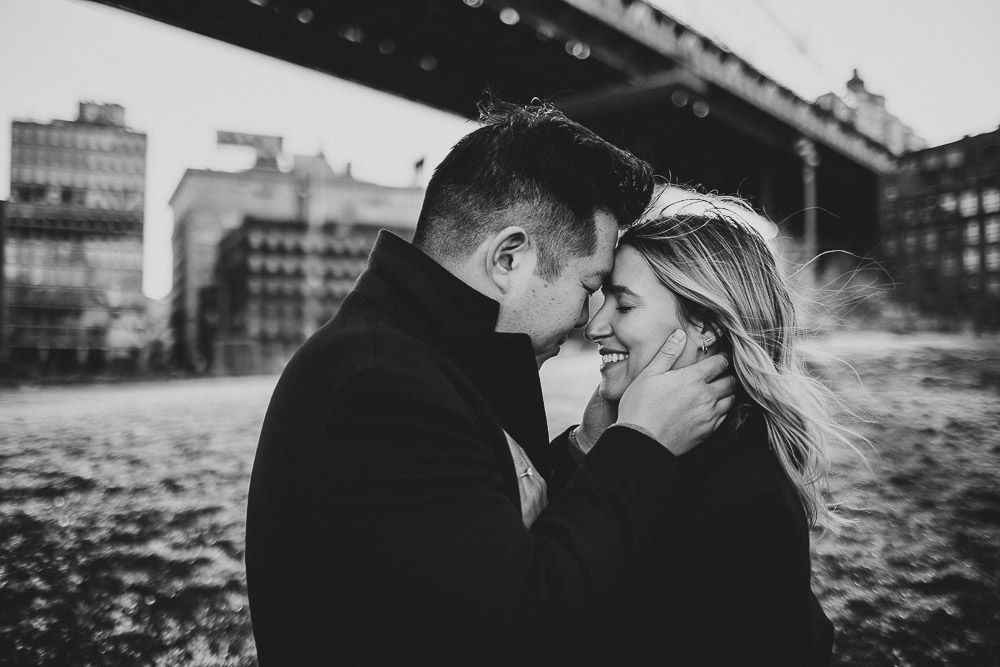 Couple during engagement photoshoot in dumbo brooklyn
