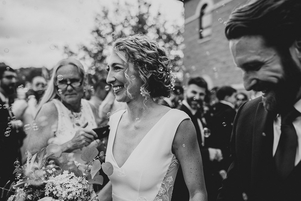 Bride and groom bubble exit after hudson valley wedding ceremony