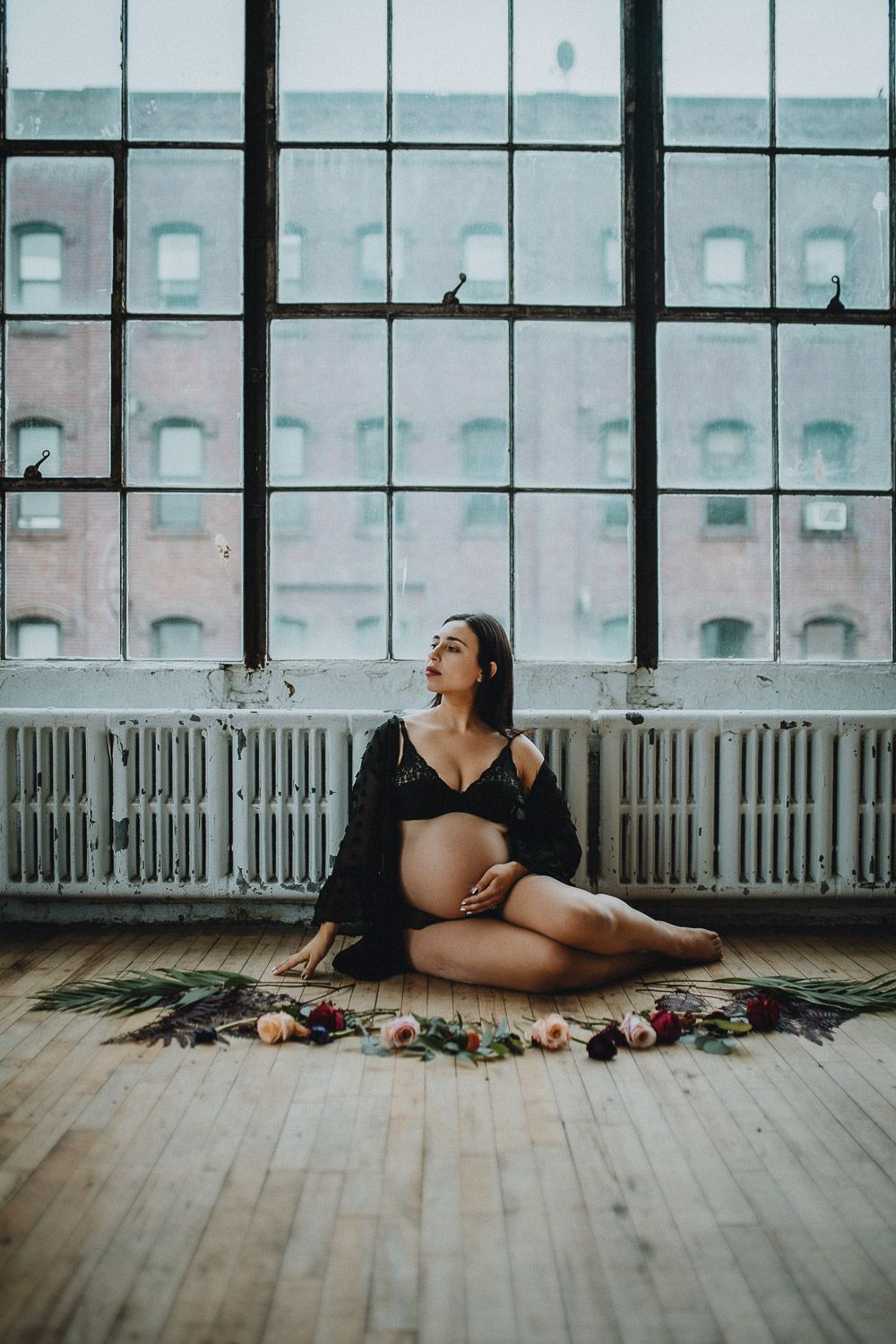 Pregnant woman during intimate maternity session at home in brooklyn