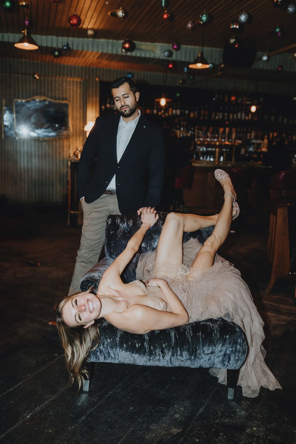 Bride in groom in brooklyn bar at wedding after party