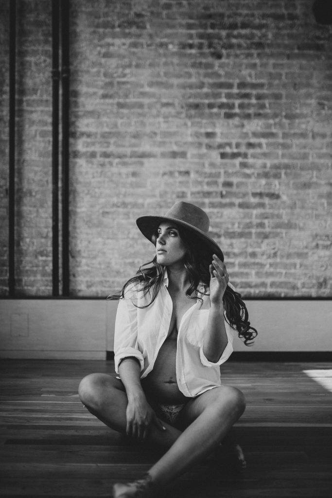 Naked pregnant woman during maternity session in nyc home