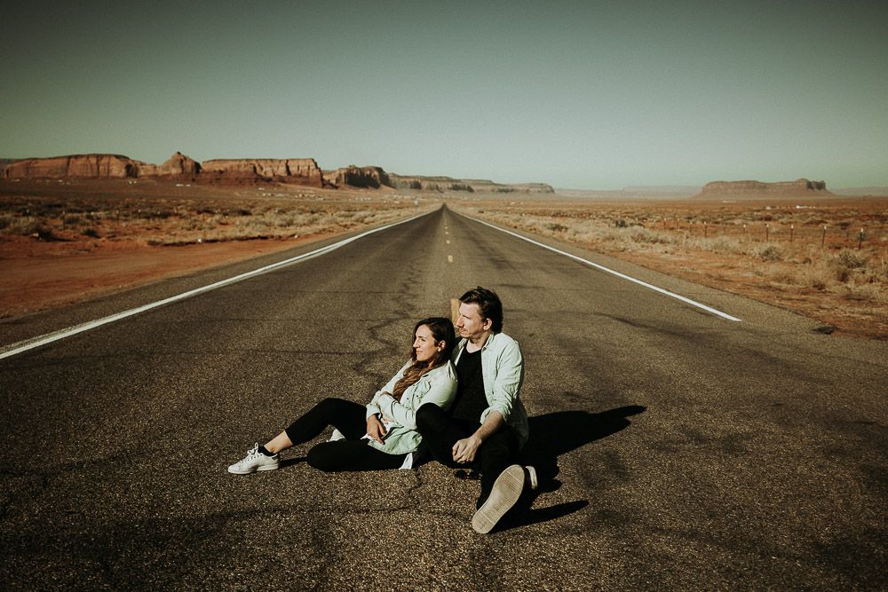 Couple in middle of road during monument valley elopement