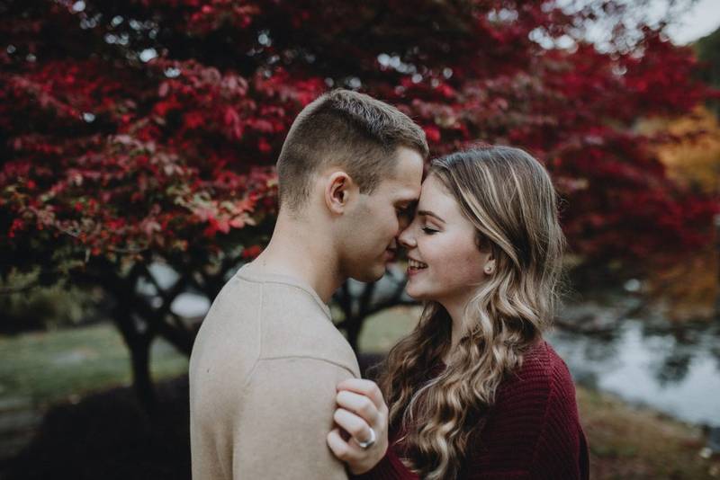 Couple during fall engagement photoshoot in west point