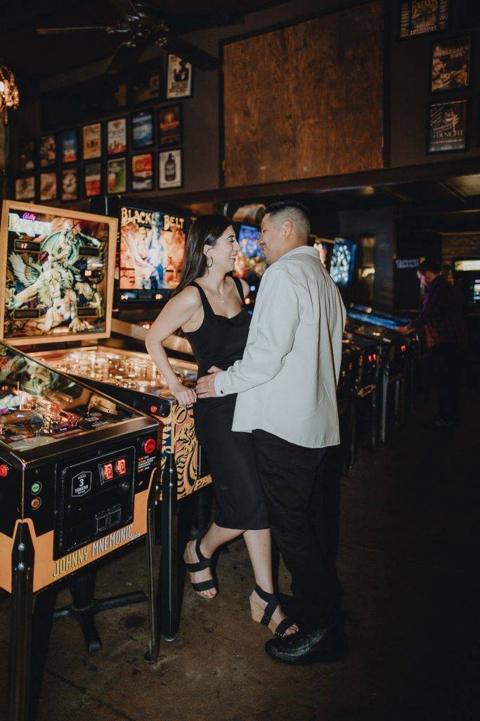 Couple during engagement photo session at bar in williamsburg