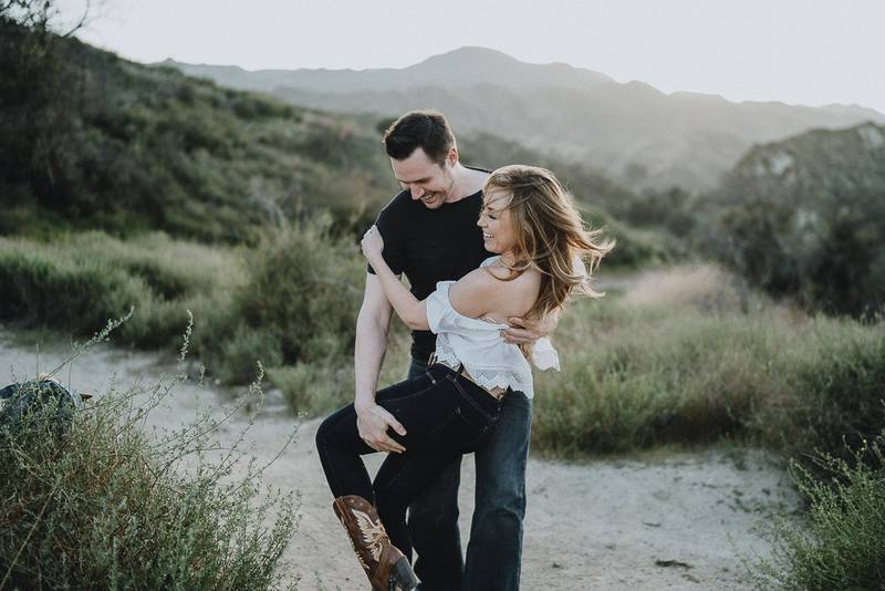 Couple dances during engagement session in los angeles canyon