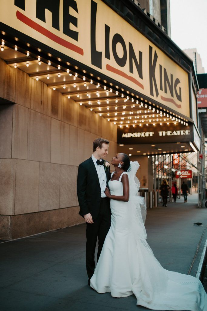 Interracial bride and groom at nyc wedding in theatre district