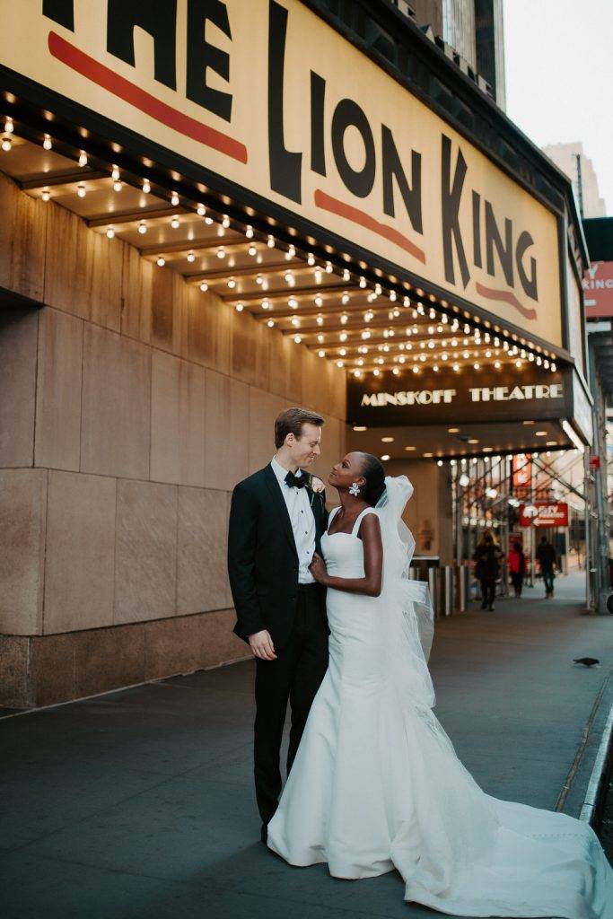 Interracial bride and groom at nyc wedding in theatre district