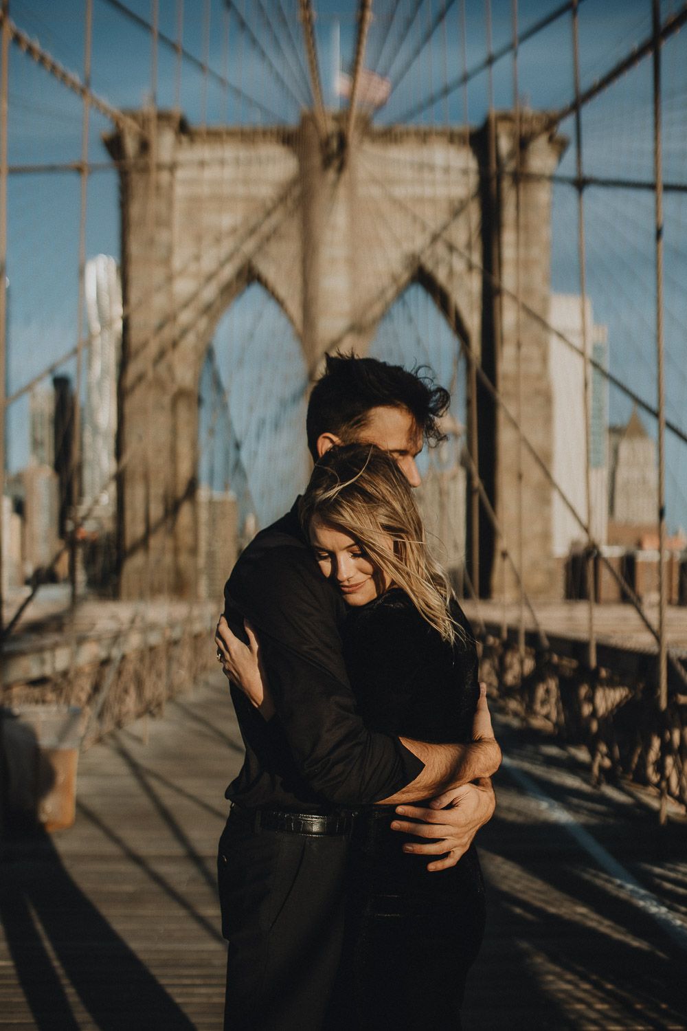 Couple on brooklyn bridge at sunrise during elopement photoshoot