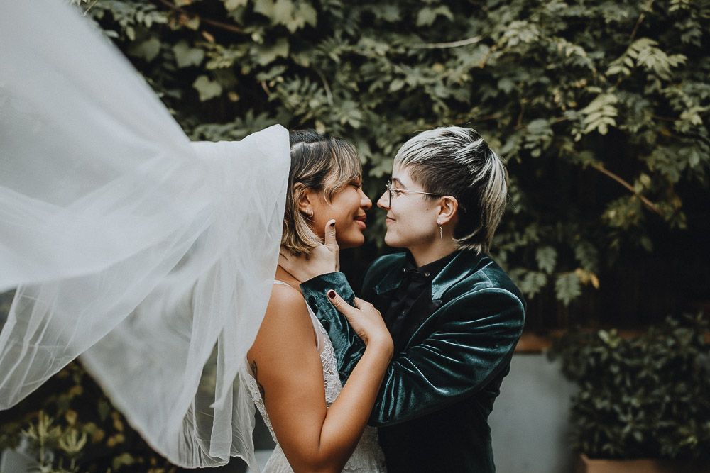 LGBTQ brides' veil shot at brooklyn patio micro wedding