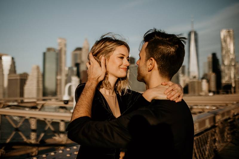 Couple on brooklyn bridge at sunrise during elopement photoshoot