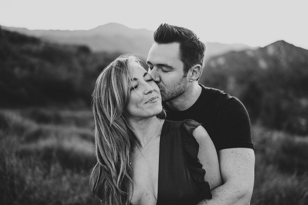 Man kisses fiancée during engagement session in los angeles canyon