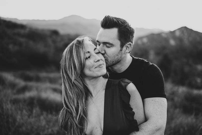 Man kisses fiancée during engagement session in los angeles canyon