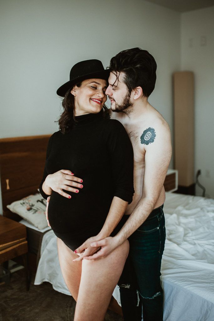 Expecting couple during maternity photoshoot at home in brooklyn