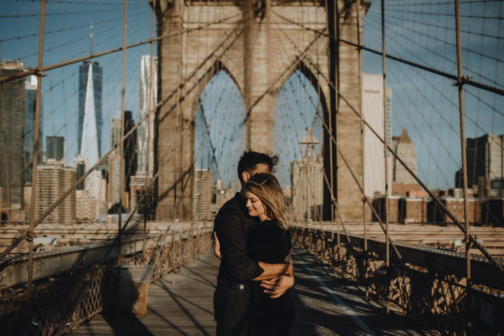Couple on brooklyn bridge at sunrise during elopement photoshoot