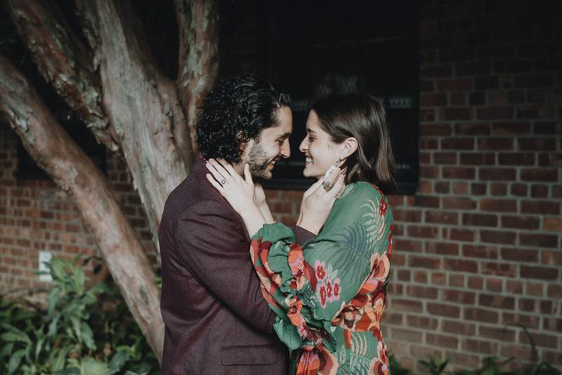 Couple laughing in brooklyn backyard during elopement