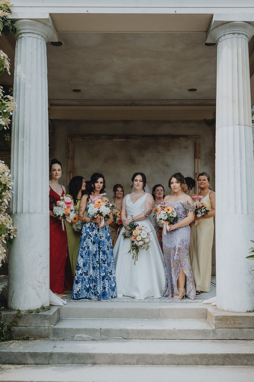 Colorful mismatched bridesmaids at tuscany italy wedding