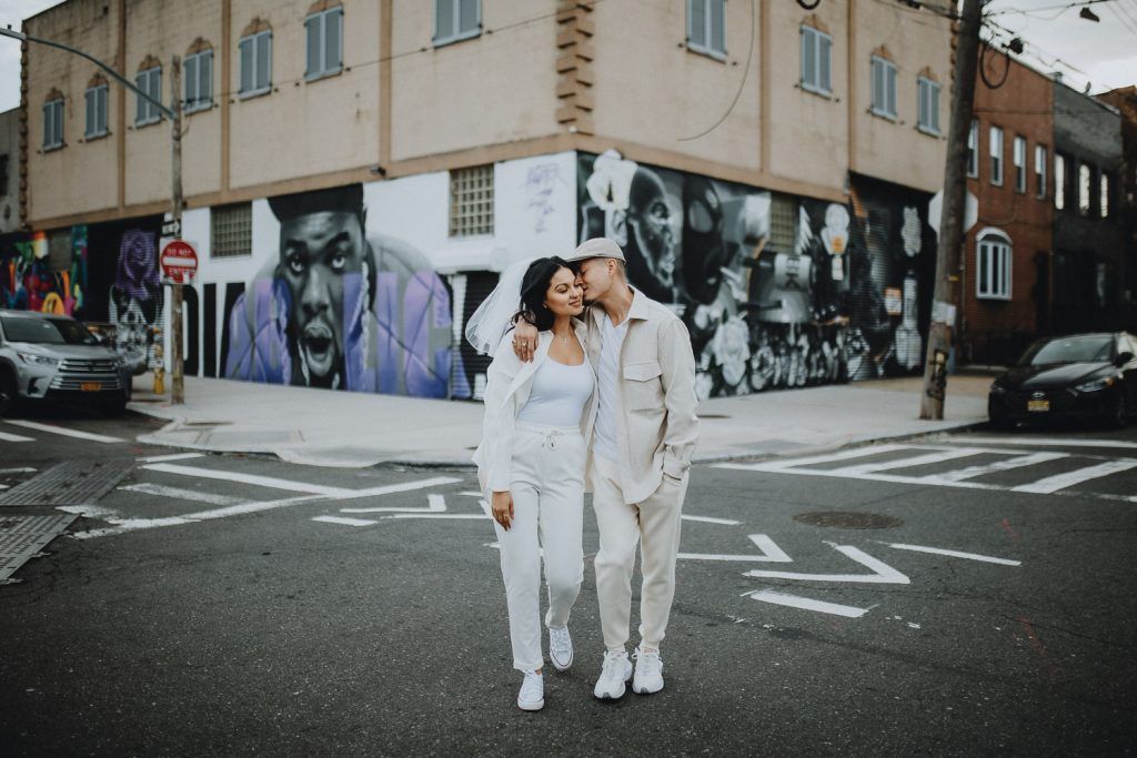 Couple during urban elopement in east williamsburg brooklyn