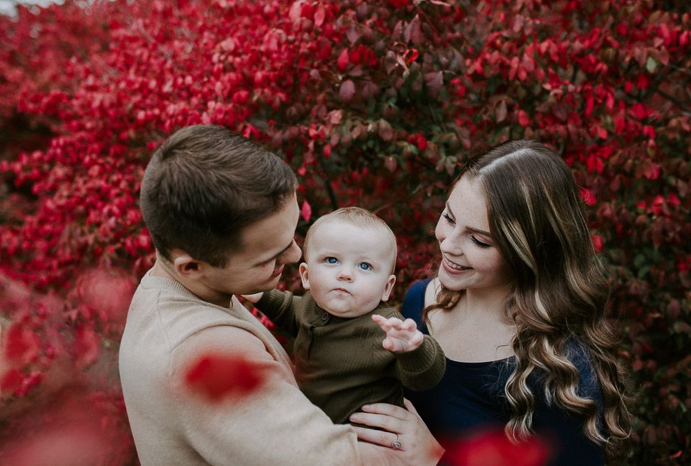 Parents and baby during fall family session in west point