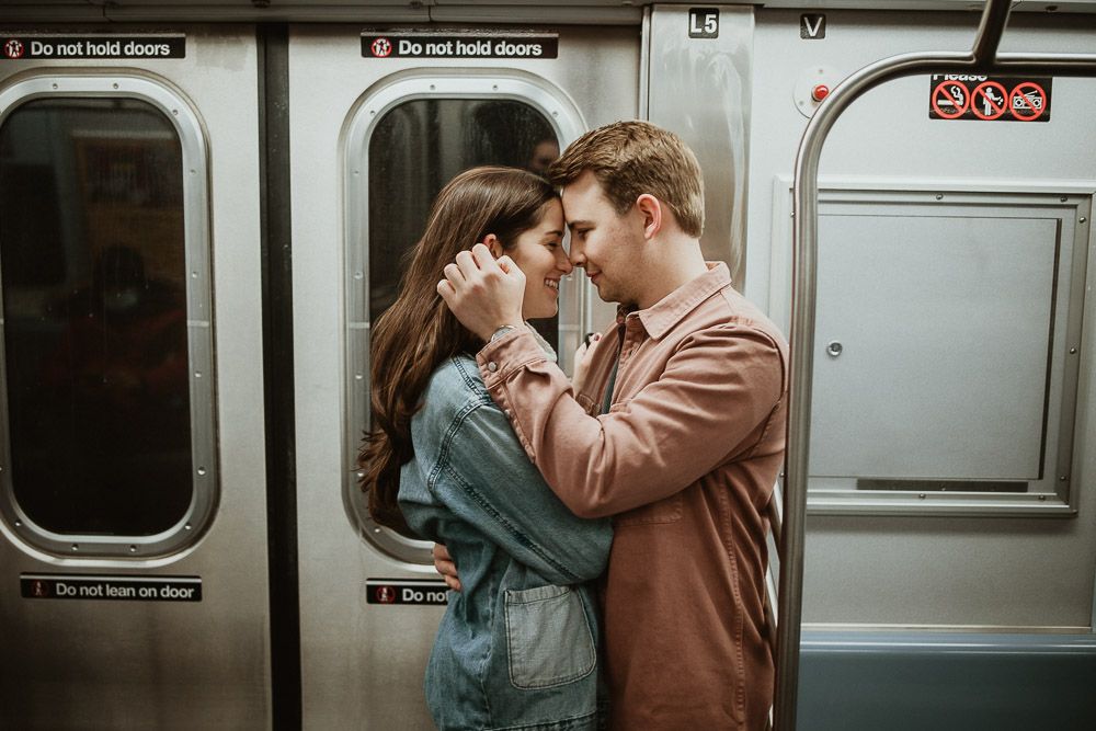 Couple during engagement shoot in the nyc subway