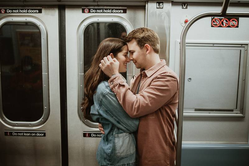 Couple during engagement shoot in the nyc subway