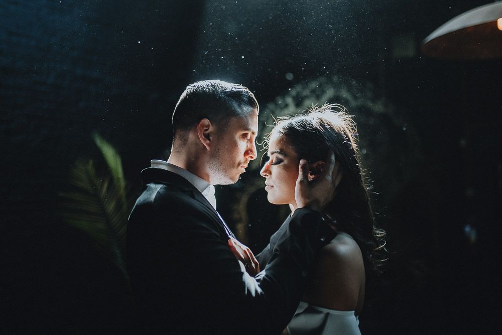 Bride and groom's backlit portrait at industrial chic wedding in brooklyn