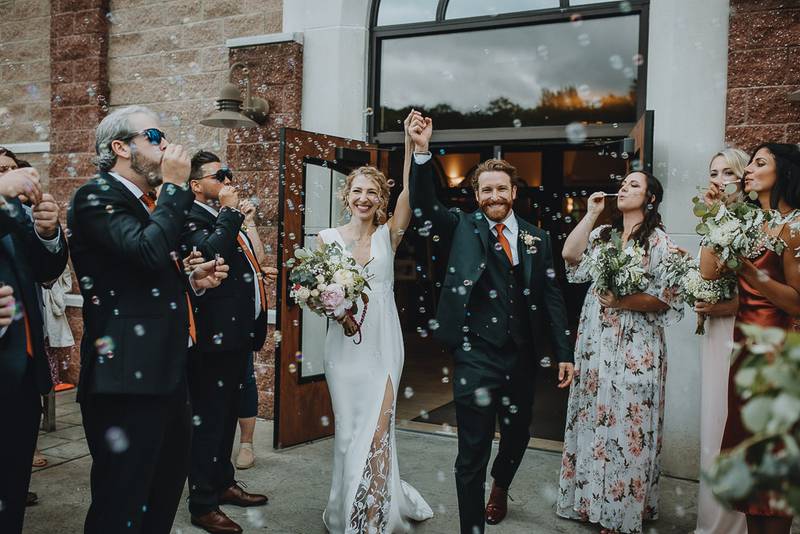 Bride and groom bubble exit after hudson valley wedding ceremony