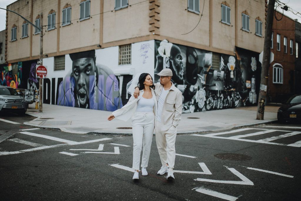 Couple during urban elopement in east williamsburg brooklyn