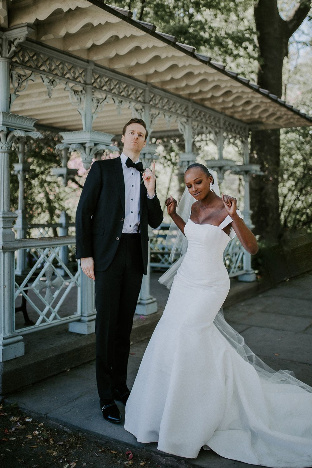 Bride and groom being silly at central park wedding in nyc