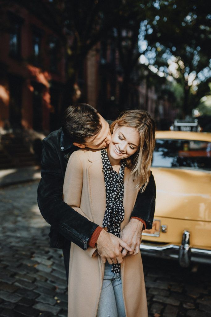 Couple by old taxi cab during nyc engagement photoshoot
