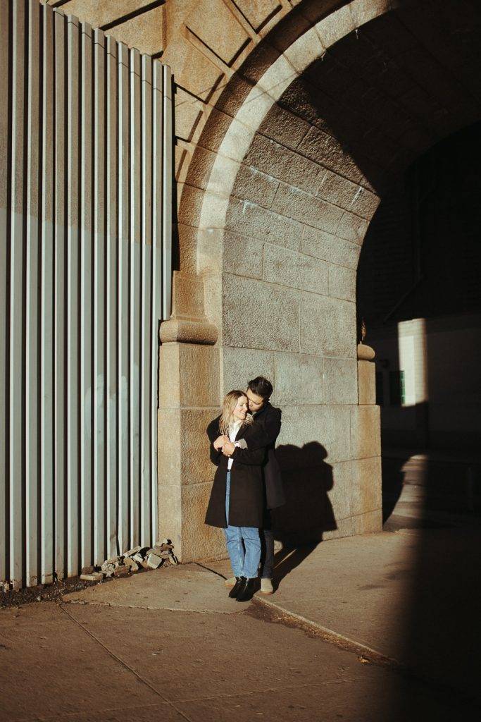 Couple during engagement photoshoot in dumbo brooklyn