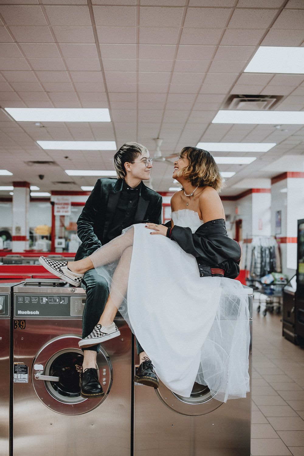 LGBTQ couple at laundromat during brooklyn elopement