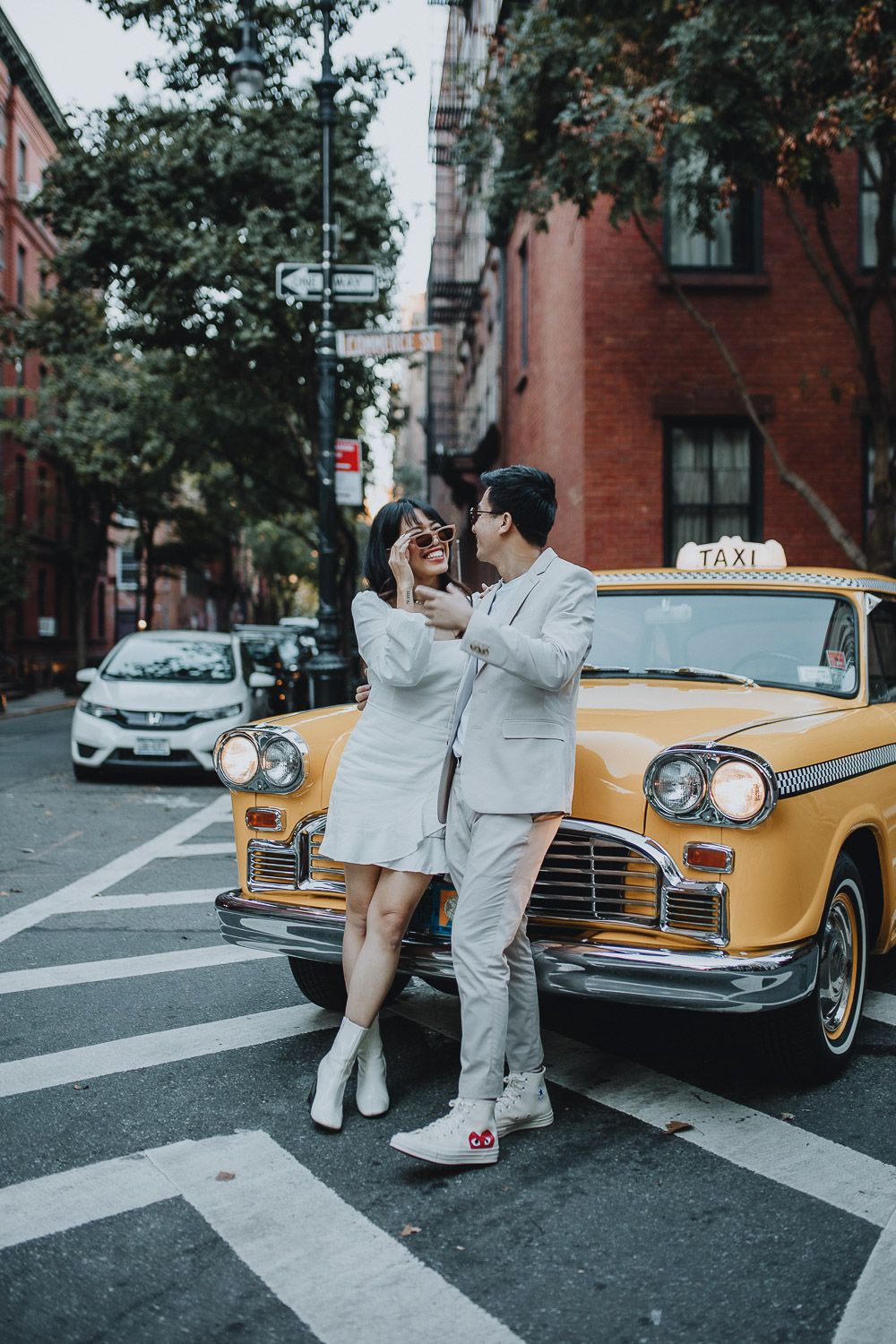 Bride and groom in vintage taxi cab during nyc elopement photoshoot