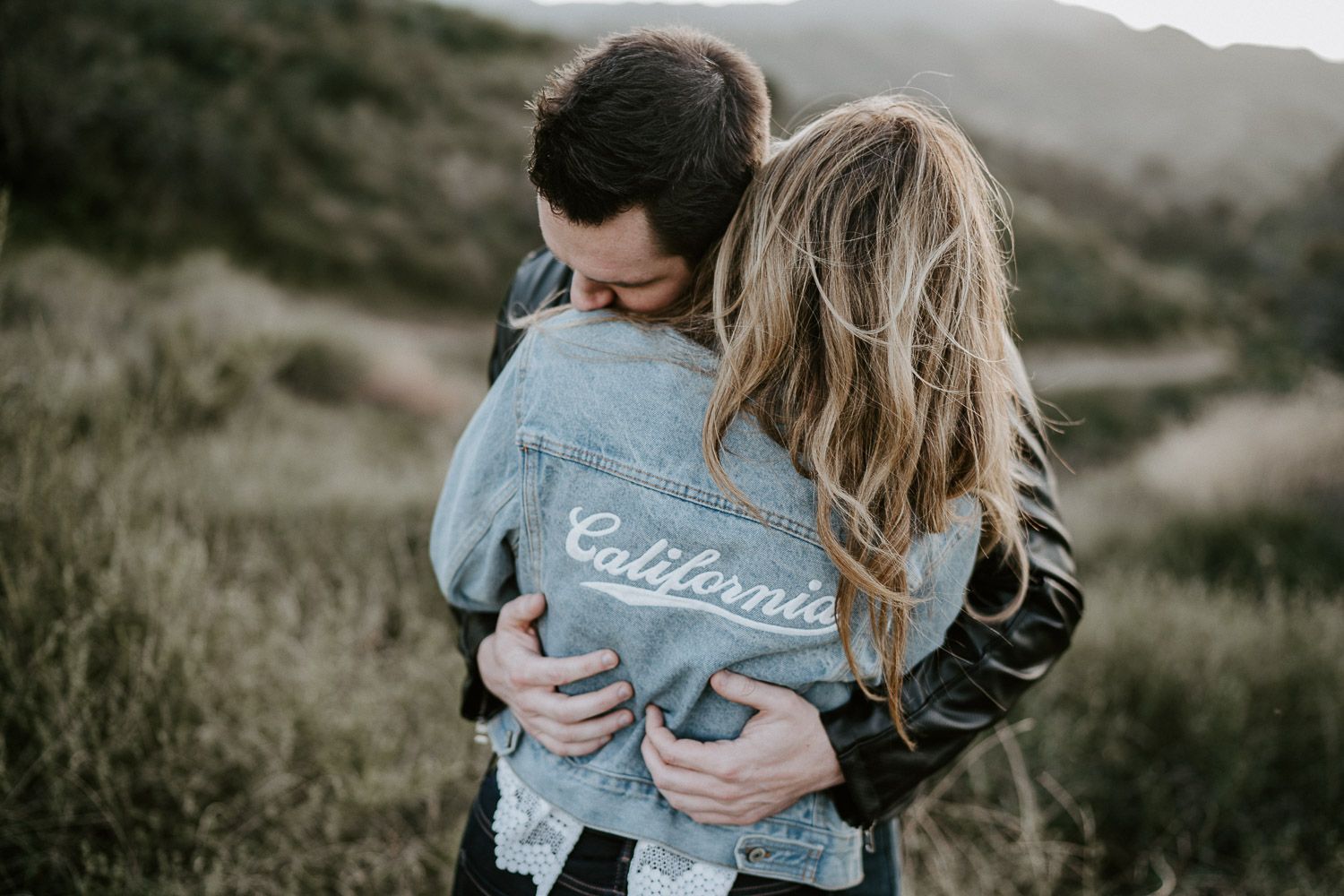 Couple during engagement session in los angeles canyon at golden hour