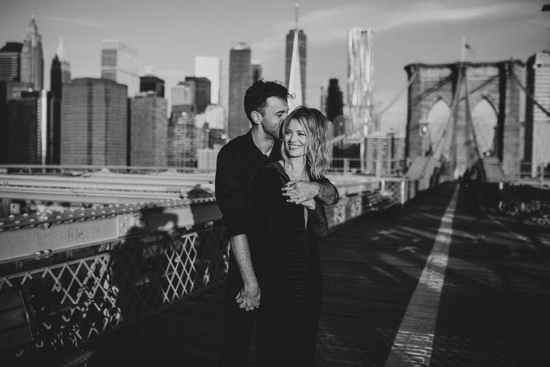Couple on brooklyn bridge at sunrise during elopement photoshoot