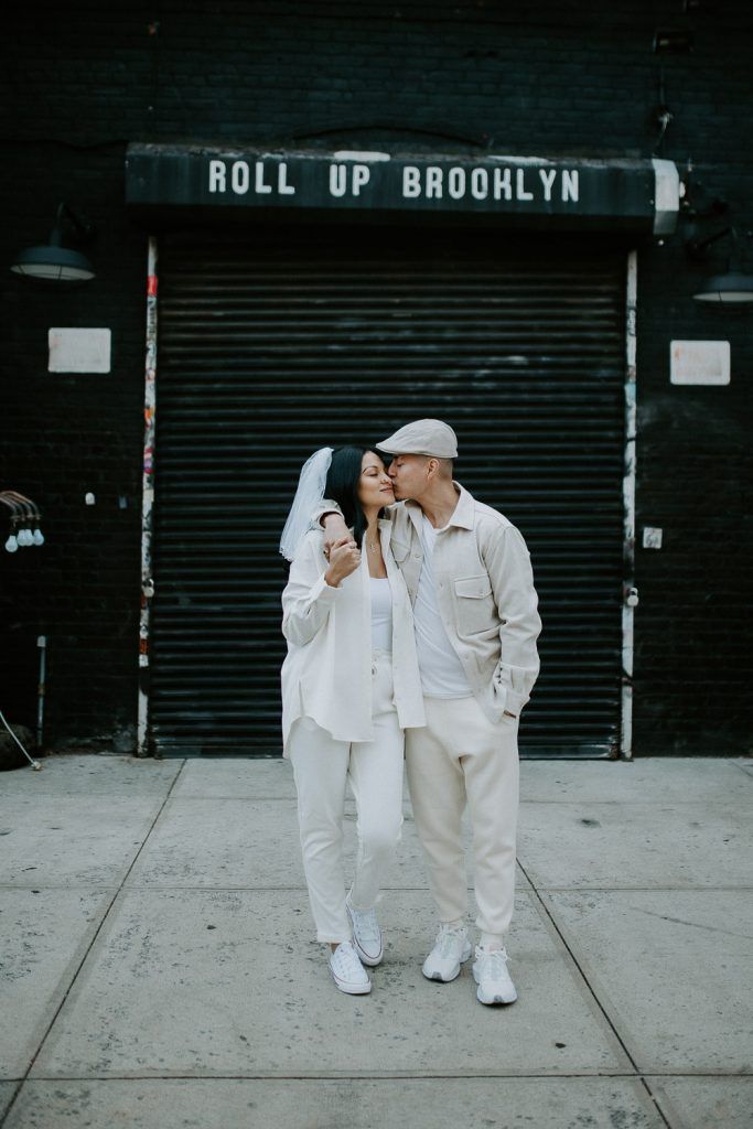 Couple during urban elopement in east williamsburg brooklyn