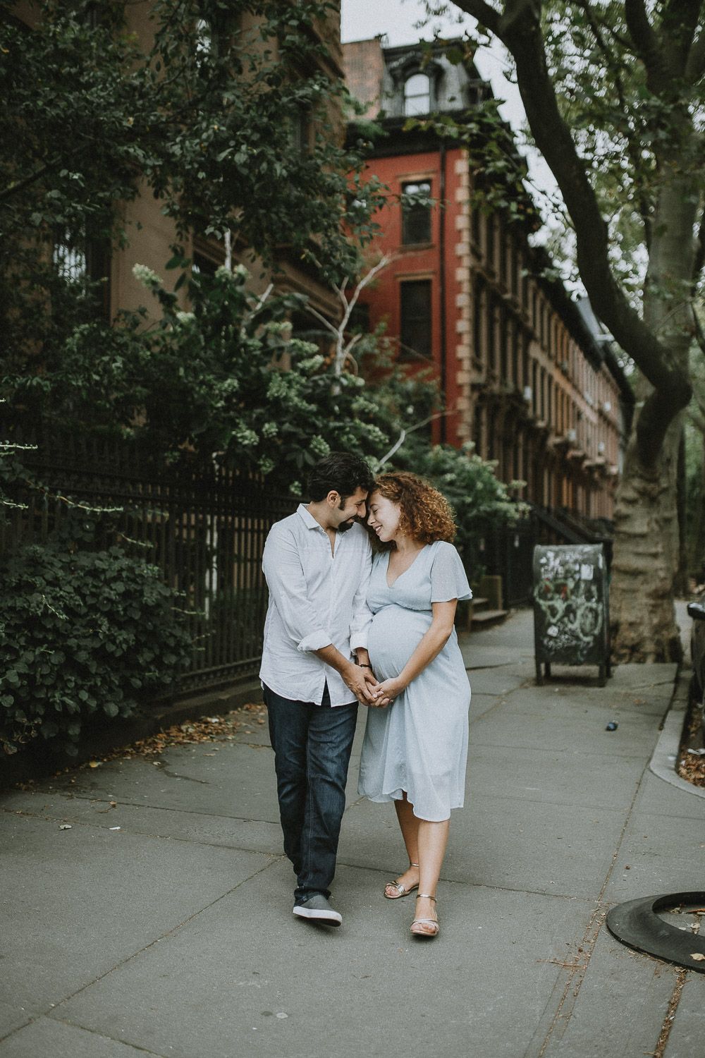 Expecting couple by fort greene brownstone during brooklyn maternity photoshoot