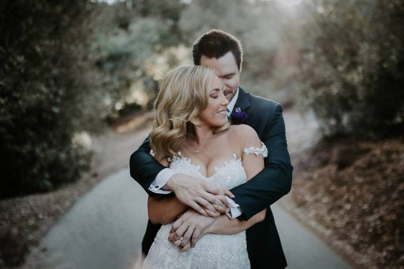 Bride and groom at golden hour in hills of los angeles