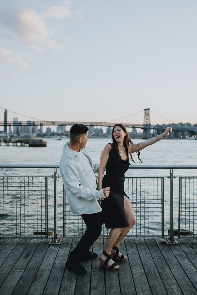 Couple during engagement photo session in williamsburg brooklyn