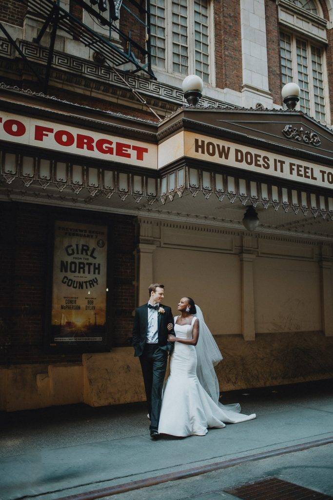 Interracial bride and groom at nyc wedding in theatre district